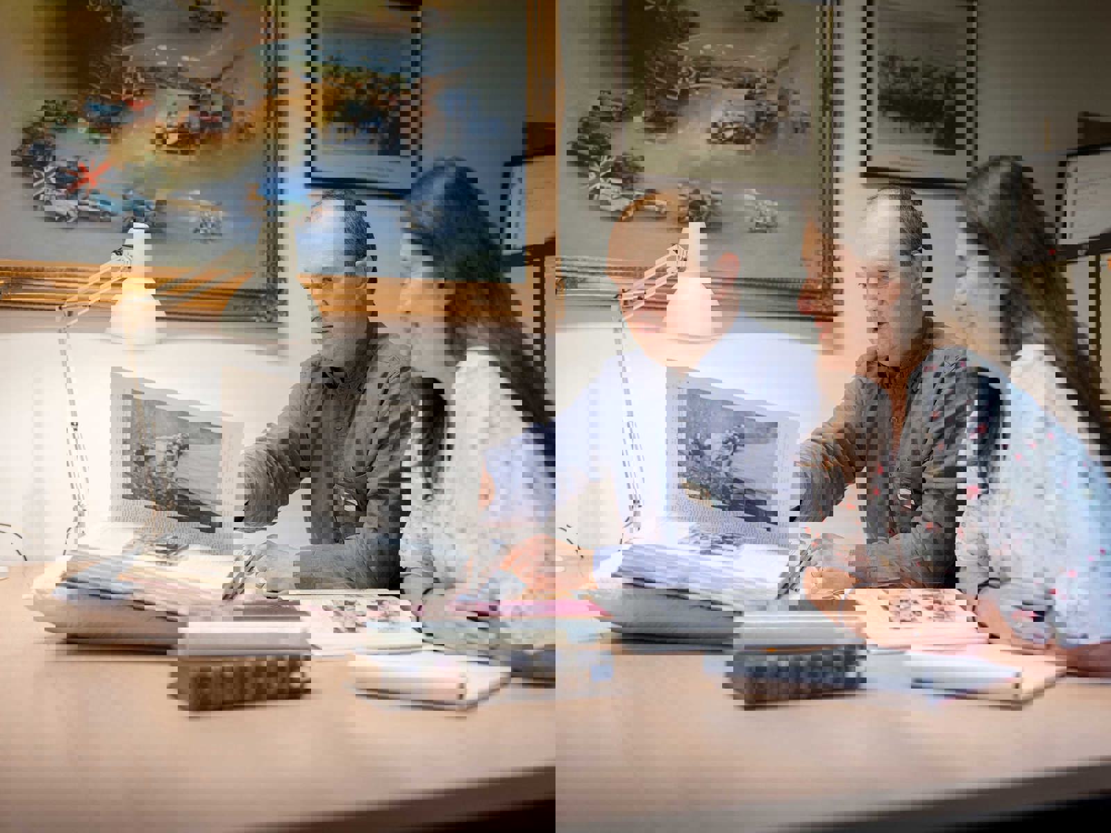 Male and female visitors to the reading room looking at book