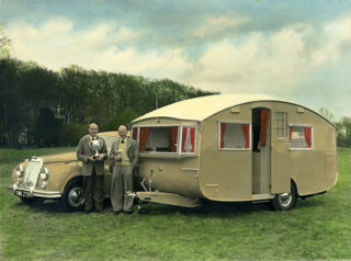 Lionel Hutchings holding the winners cup of the Concours D'Elegance at the 1958 British Caravan Road Rally