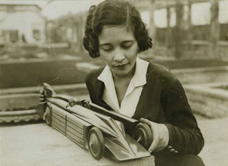 Girl holding a model of Golden Arrow (kitchener.lord / CC BY-NC-ND 2.0 )