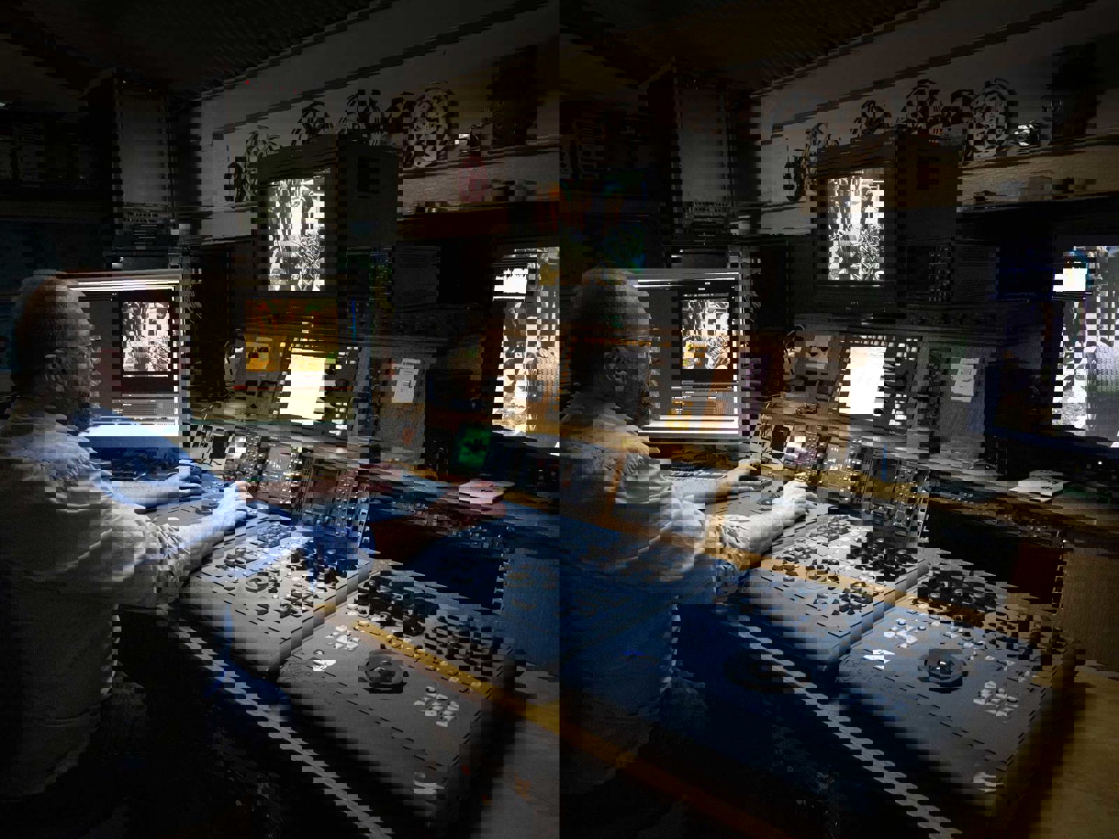 telecine operator working the HD Spirit machine across multiple screens